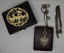 A carved ivory brooch in the form of deer, silver necklace and fob and a silver Albert