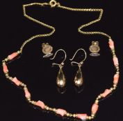 A pair of c1900 9ct gold faceted earrings, a pair of 9ct gold studs (2g), and a coral necklace