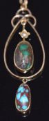 A 9ct gold pendant set with two boulder turquoise cabochons, 2.4g