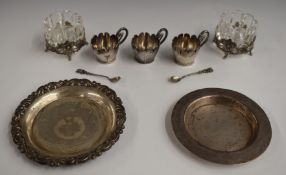Two Egyptian silver dishes, diameter of largest 11.5cm, weight 134g, two cut glass salts on silver