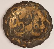 Japanese metal charger with decoration in relief of a religious or court scene with monks, within a