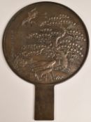 Large Japanese bronze mirror with relief moulded decoration, H49.5cm, diameter 36cm
