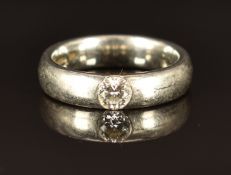 A platinum ring set with a round cut diamond of approximately 0.25ct, 9.3g, size I/J