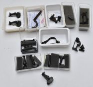 A collection of Roman bronze brooches including trumpet shaped examples