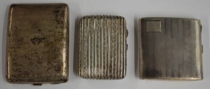 Two hallmarked silver cigarette cases including a curved example, length 11cm, weight of both