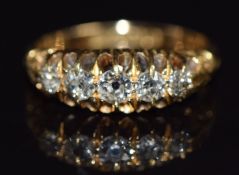 An 18ct gold ring set with five old cut diamonds, Birmingham 1911, size L/M, 3.5g