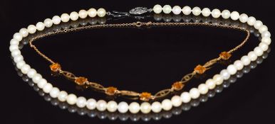 A 9ct gold necklace set with paste (5.5g) and a single strand cultured pearl necklace with silver