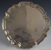 George VI hallmarked silver salver with shaped edge, raised on three feet, Sheffield 1938,