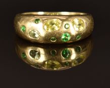 A 9k gold ring set with sphene, demantoid and tsavorite garnets, size M, 2.4g