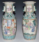 A pair of late 19th/20thC Chinese vases decorated with court scenes, H25cm