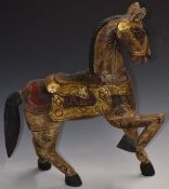 Indian carved wooden horse with gilt and painted decoration