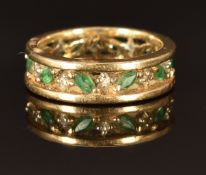 A 9ct gold eternity ring set with emeralds and diamonds, size N, 4.7g