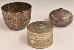 Indian, Burmese or similar white metal bowl with embossed decoration of  animals, together with