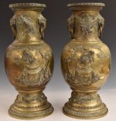A pair of Chinese brass vases with relief moulded decoration and ring handles, H45cm