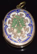 Victorian pinchbeck locket depicting acorns set with enamel and scrolling decoration, 3.2 x 2.6cm