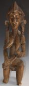 African tribal Bamana carved fertility/ maternity figure of a seated mother feeding her child,