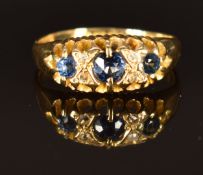 An 18ct gold ring set with sapphires and diamonds, Birmingham 1907, size O, 3.8g