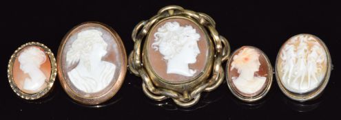 Three silver brooches/ pendants set with cameos and two pinchbeck brooches set with cameos