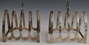 George VI pair of hallmarked silver five bar toast racks with trefoil handles, Birmingham 1938,