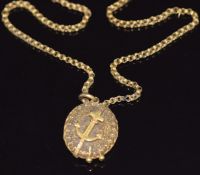 Victorian locket depicting an anchor on a Victorian yellow metal chain