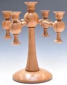 Arts and Crafts turned oak pedestal candelabra, diameter 32cm, H34cm