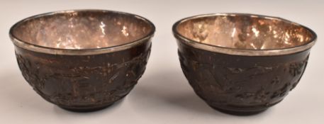 A pair of 18th/19thC Chinese silver lined carved coconut shell or similar wine cups with silver