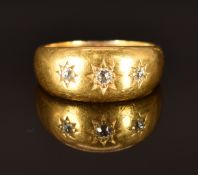 Victorian 18ct gold ring set with three diamonds in star settings, size N, 8.9g