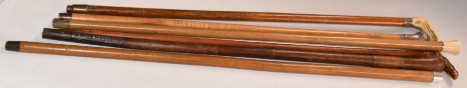 Six walking sticks and canes to include 9ct gold mounted ivory topped cane, hallmarked silver