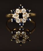 A 9ct gold ring set with sapphires and diamonds in a flower cluster, size N, 1.8g