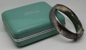 A silver bangle with engraved decoration in original 'Felicity by Excalibur' box