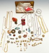 A collection of jewellery including Art Deco glass pendant, bone necklace, silver curb link