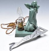Novelty cast metal lamp base formed as a nude lady, H18cm, together with a novelty lady's leg bottle