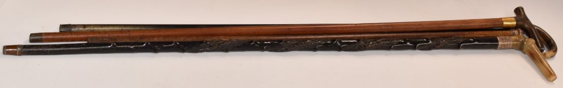 Four walking sticks to comprising a Brigg example with hallmarked gold collar, two hallmarked silver