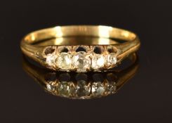 An 18ct gold ring set with five old cut diamonds, size P, 2.3g