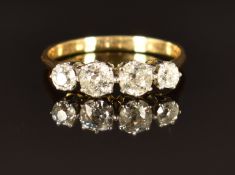 An 18ct gold ring set with four old cut diamonds, total diamond weight approximately 0.8cts, size L,