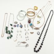 A collection of jewellery including a two hardstone bangles, rolled gold bangles, silver gilt