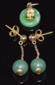 A pair of 14k gold earrings with a drop aventurine quartz bead to each and a charm