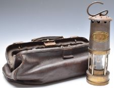 Thomas and Williams, Aberdare miner's lamp and a vintage leather Gladstone bag, L45cm