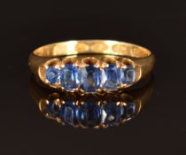 An 18ct gold ring set with sapphires and diamonds, Birmingham 1941, size N, 3.3g