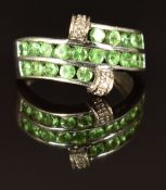 A 9k white gold ring set with tsavorite garnets and zircon, size L/M, 3.6g