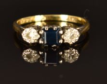 An 18ct gold ring set with a square cut sapphire and diamonds in platinum setting, 2.4g, size K