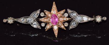 Victorian brooch set with an oval cut pink sapphire of approximately 0.5ct surrounded by rose cut