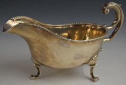 George V hallmarked silver sauce boat, raised on three feet, Birmingham 1932, maker P J Finch Ltd,