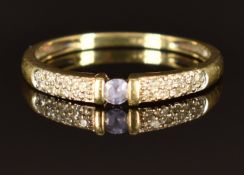 A 9ct gold ring set with a tanzanite and diamonds, size O/P, 1.5g
