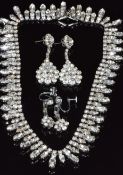 A diamanté necklace and two pairs of earrings