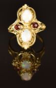 A 9ct gold ring set with opals and garnets, size L, 5g