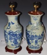 A pair of Chinese porcelain table lamps on wooden bases, H51cm