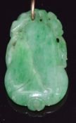 A carved jadeite pendant in the form of a pear, 3.5 x 2cm