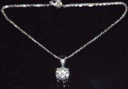 A 14k white gold pendant set with a round cut moissanite (1.1g) on 18ct white gold chain (length