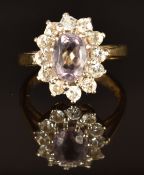 A 9ct gold ring set with an oval cut amethyst and cubic zirconia, size K/L, 3.9g